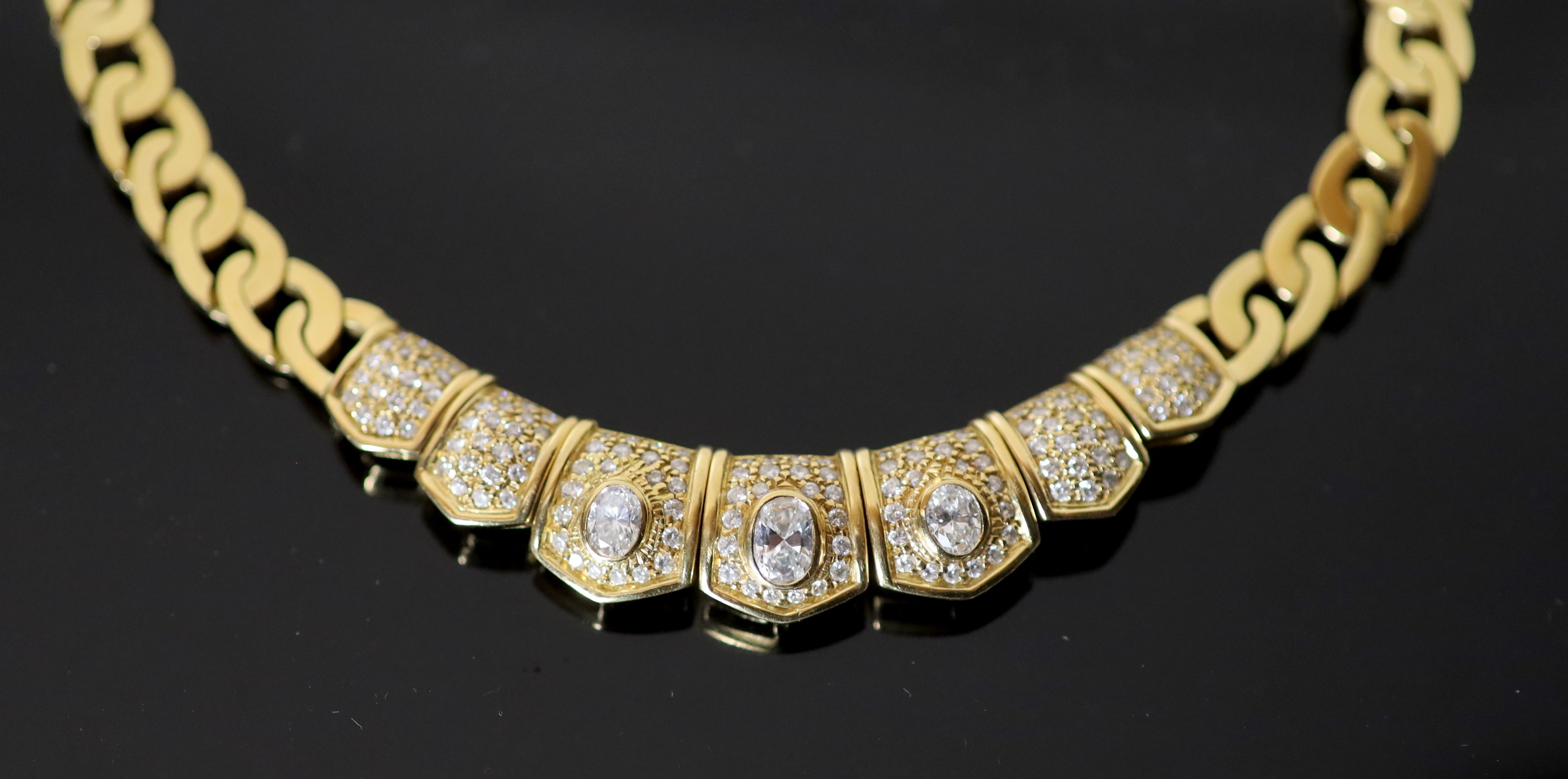 A modern Middle Eastern (possibly Egyptian) gold and diamond set oval curblink necklace,